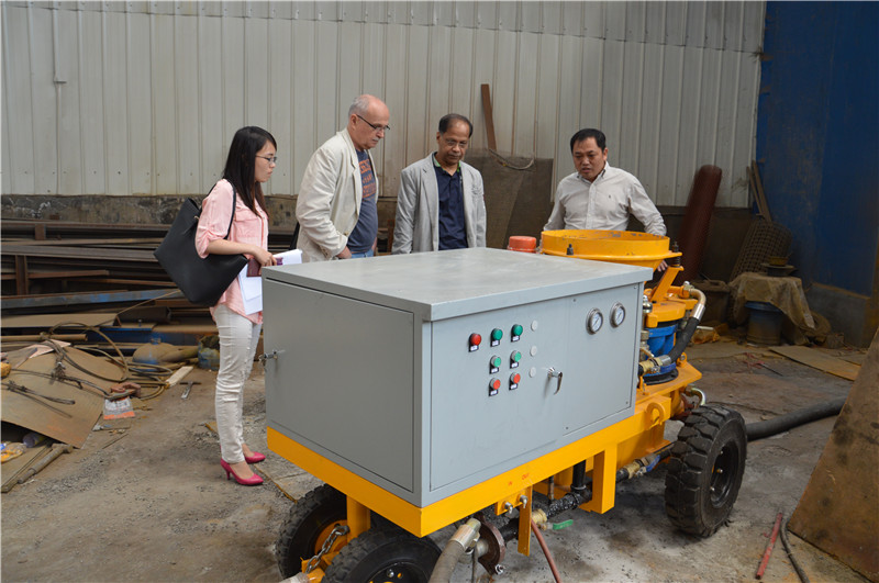 Wet shotcrete machine during the construction of the slope